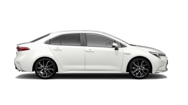 a white, modern sedan, stationary, viewed from the side with sleek, aerodynamic design and black alloy wheels, set against a plain white background.